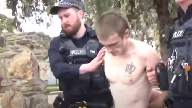 Galffy is taken away by police after being arrested. Picture: 7NEWS