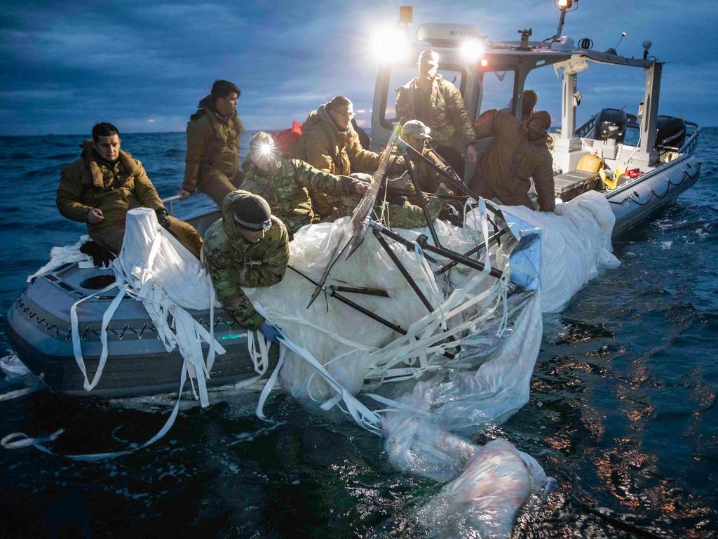 US Navy sailors recover parts of the balloon. Picture: Petty Officer 1st Class Tyler Thompson/US Navy/AFP