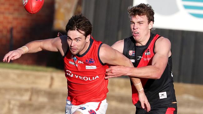 Riley Thilthorpe battles it out with Norwood's Lewis Johnston. Picture: Sarah Reed