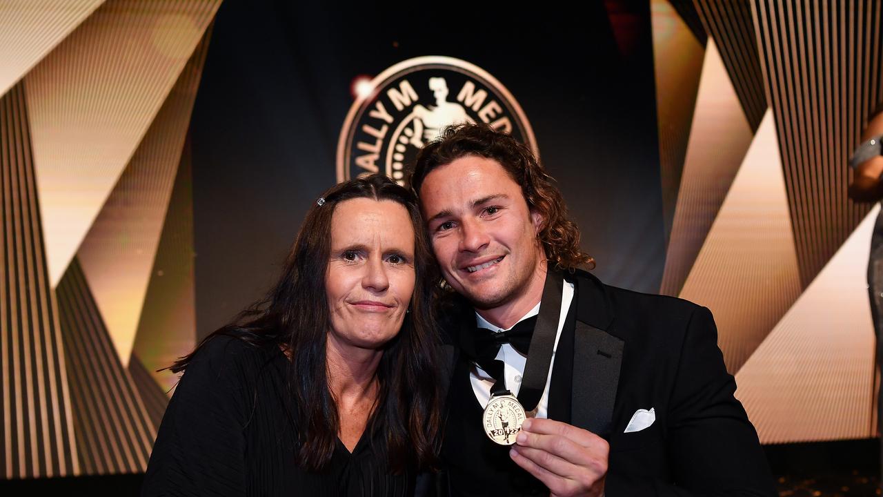 Nicho Hynes with his mum and the Dally M medal.