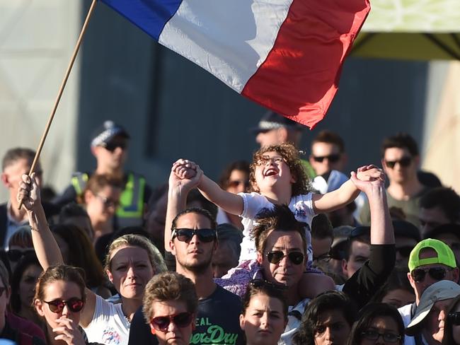 Crowds at Federation Square honouring those killed in the Paris attacks. Picture: Tony Gough