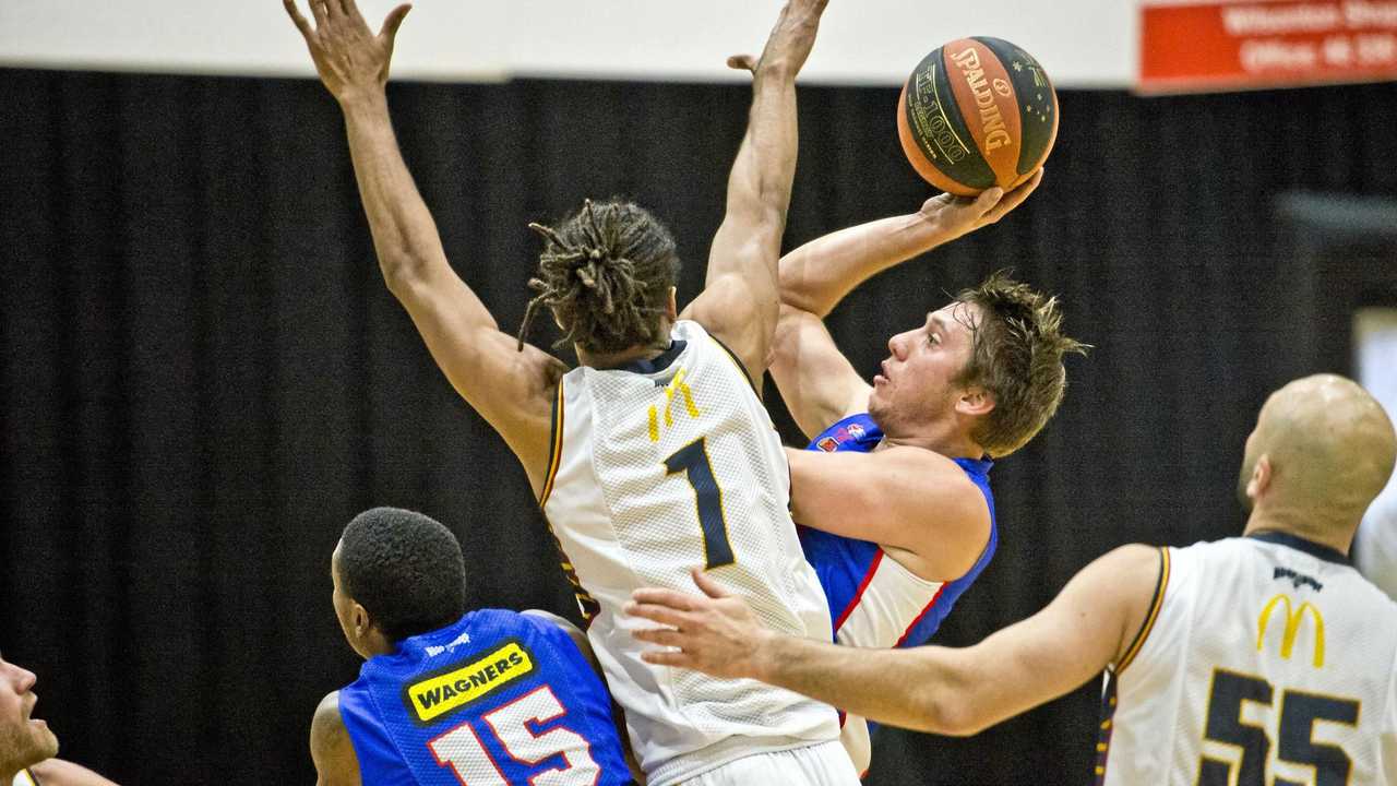 IN THE LANE: Mountaineers guard Jason Ebneter shoots in traffic during his side&#39;s match agains the Logan City Thunder. Picture: Nev Madsen