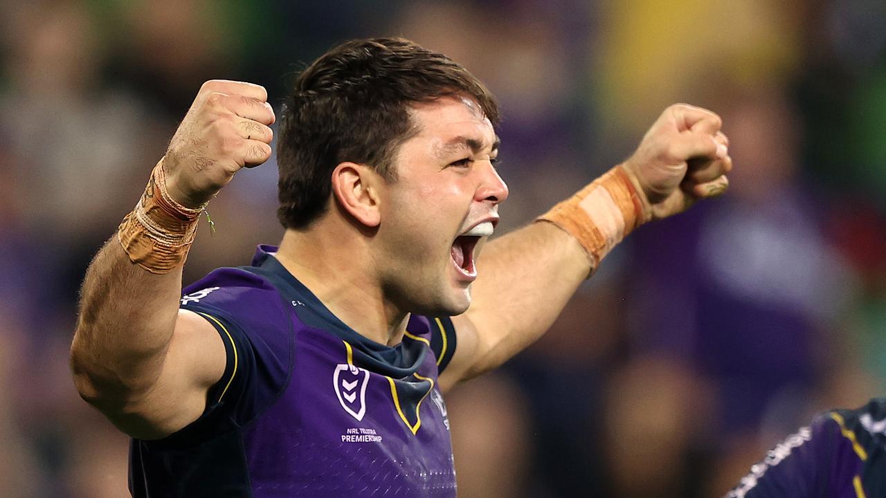 MELBOURNE, AUSTRALIA - APRIL 30: Brandon Smith of the Storm celebrates with team mates after scoring a try during the round eight NRL match between the Melbourne Storm and the Cronulla Sharks at AAMI Park on April 30, 2021, in Melbourne, Australia. (Photo by Robert Cianflone/Getty Images)