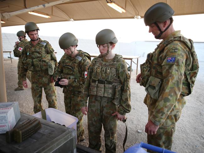 Strong men ... Australian Defence Force personnel preparing for war. Picture:  Gary Ramage