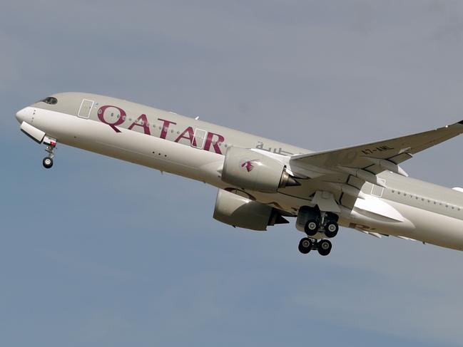 (FILES) This file photo taken on September 27, 2019 shows a Qatar Airways Airbus A350 aircraft taking off from Toulouse-Blagnac airport, near Toulouse. - Revelations that passengers flying through Doha were forced to endure vaginal inspections have upended Qatar's efforts to boost its reputation before the Gulf state hosts World Cup 2022, experts say. Officers marched women off a Sydney-bound Qatar Airways flight earlier this month and forced them to undergo intimate examinations after a newborn baby was found abandoned in an airport bathroom. (Photo by PASCAL PAVANI / AFP)