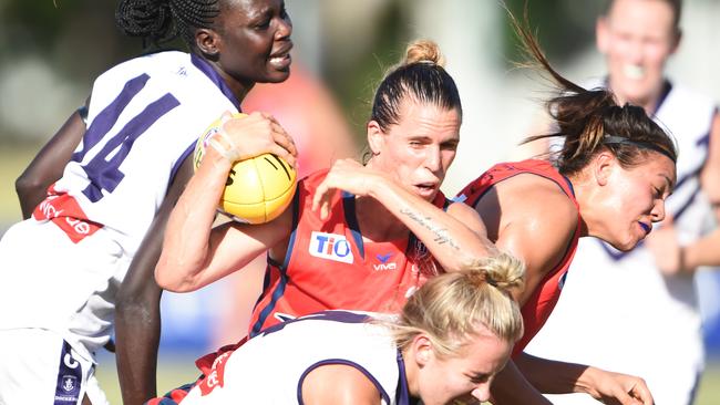 Hard at it ... Adelaide co-captain Chelsea Randall Women's AFL — Adelaide Crows v Fremantle — Fremantle player Makur Chout and Crows player Chelsea Randall and Tayla Thorn.