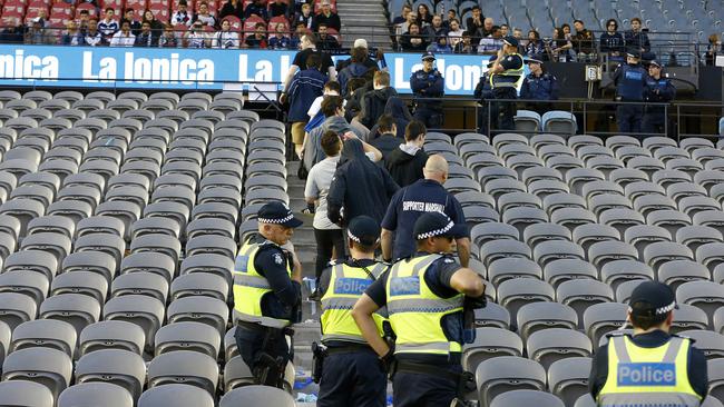 Victory fans walk out in protest in the game against Adelaide.