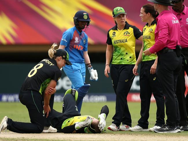 Alyssa Healy is tended to after her head knock during the match with India. Pic: Getty Images