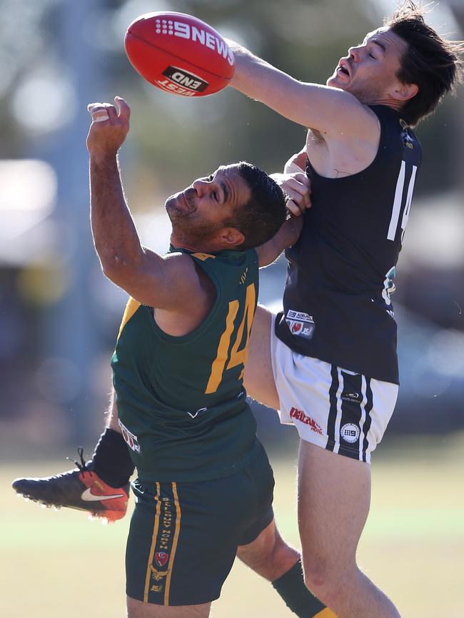 Alexander Stengle, of Salisbury North, clashes with Mitchell Gafney, of Port, on July 1, 2017 (AAP Image/James Elsby)