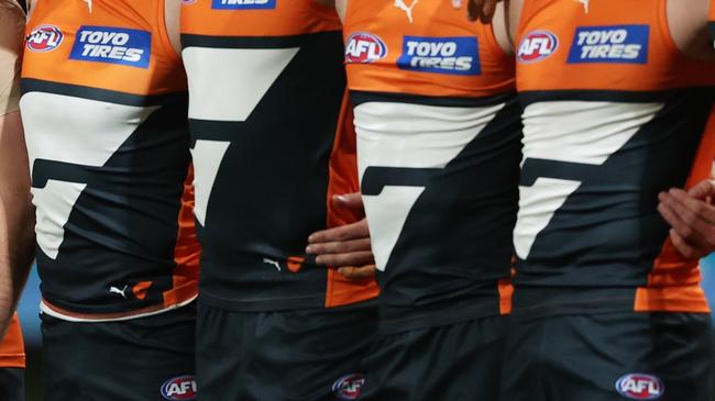 SYDNEY, AUSTRALIA - SEPTEMBER 14:  The Giants line up for the welcome to country and national anthem ceremony during the AFL First Semi Final match between GWS Giants and Brisbane Lions at ENGIE Stadium, on September 14, 2024, in Sydney, Australia. (Photo by Matt King/AFL Photos/via Getty Images)