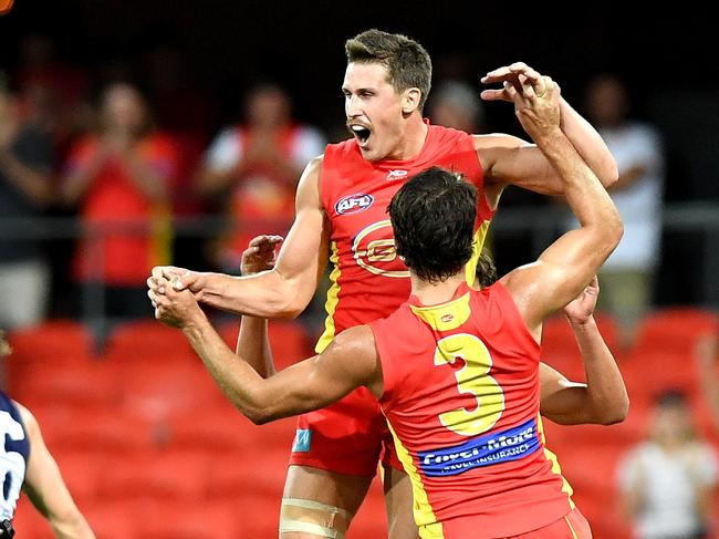 David Swallow of the Suns celebrates kicking a goal during the round two AFL match between the Gold Coast Suns and the Fremantle Dockers at Metricon Stadium on March 31, 2019 in Gold Coast, Australia. (Photo by Bradley Kanaris/AFL Photos/Getty Images)