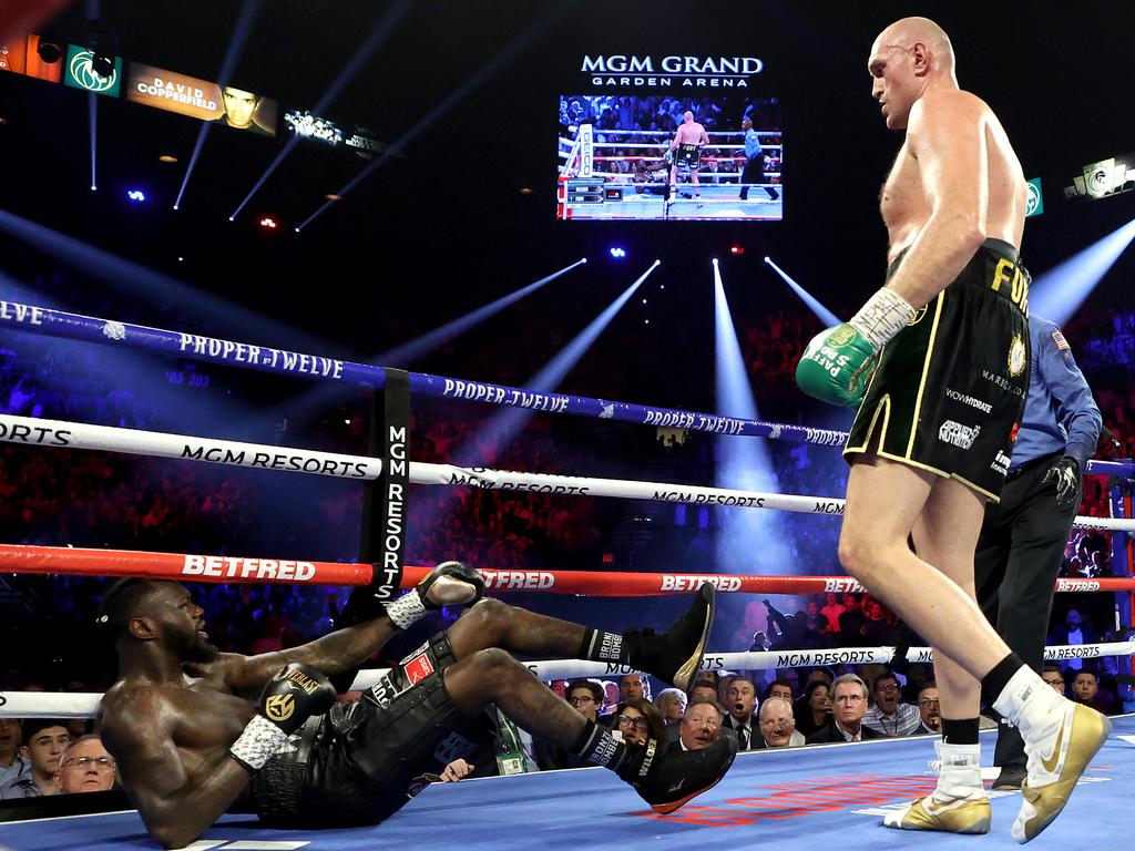 Tyson Fury knocks down Deontay Wilder