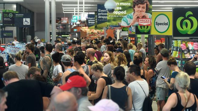 Long queues at Woolworths supermarket at Airlie Beach yesterday. Picture: AAP