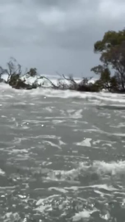 Sections of a sandbar are eroding as Cyclone Alfred moves down the Queensland coastline