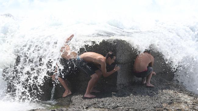 Surfers enjoy large waves at Snapper Rocks .Picture Mike Batterham