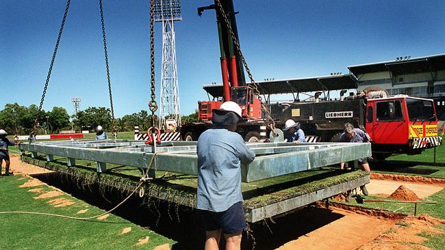 The drop-in wicket is lowered into place at TIO Stadium in June, 2003. Picture: Clive Hyde