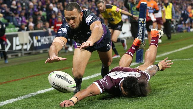 Chambers goes over the top of Jorge Taufua to score. Photo: AAP Image/Hamish Blair