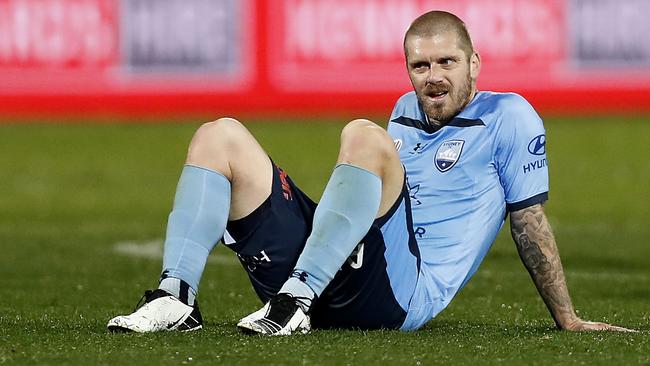 Luke Brattan looks dejected after Sydney FC went down in injury time.