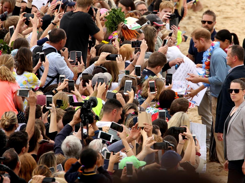 Meghan and Harry on Bondi beach meeting the locals. Picture: John Grainger