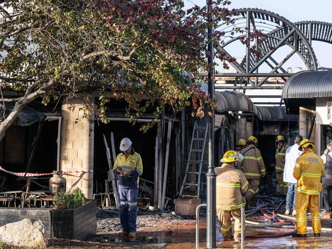 15-04-2024 Firefighters attend the scene where multiple properties were destroyed by fire in Gilbert Street, Torquay. Picture: Brad Fleet