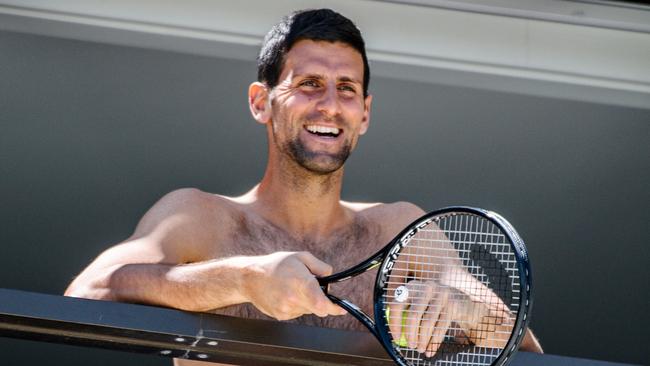 World No 1 Novak Djokovic to fans from a hotel balcony while in quarantine in Adelaide Picture: AFP