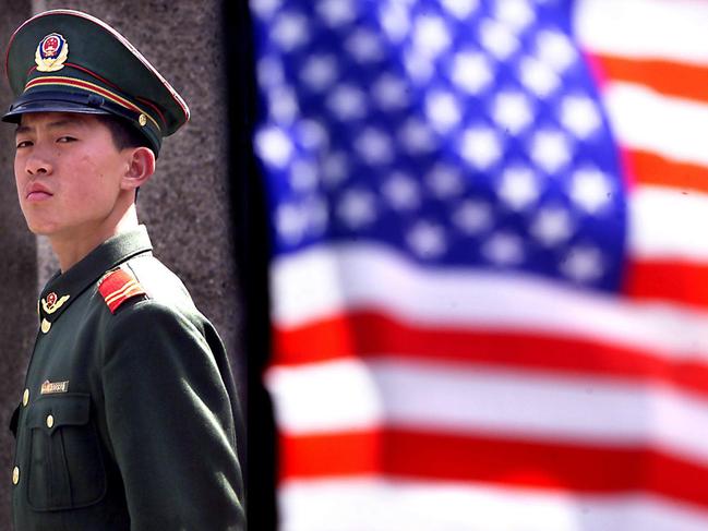 A Chinese military police officer stands guard outside the US Embassy in Beijing. Picture: Supplied