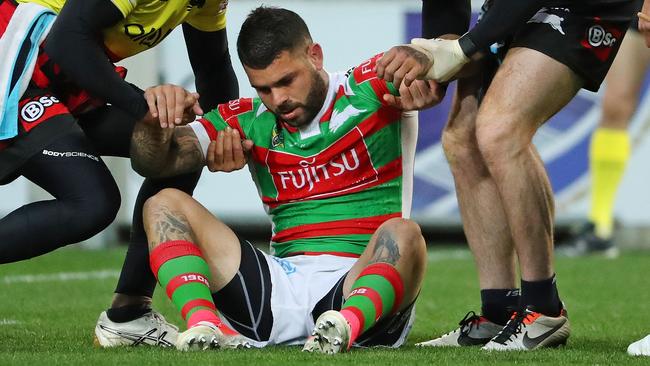 Adam Reynolds of the Rabbitohs leaves the field injured.