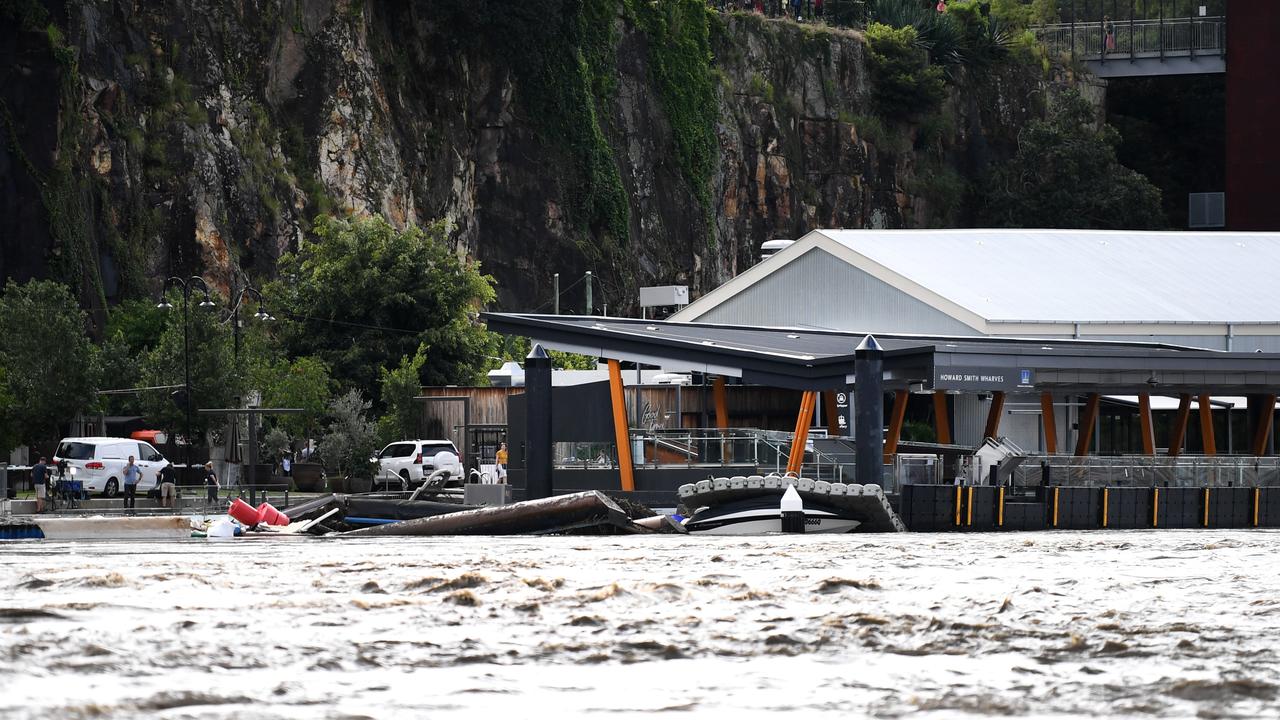 AFTER: The Howard Smith Wharves ferry terminal has been swallowed up by Brisbane River following extreme weather. Picture: NCA NewsWire / Dan Peled