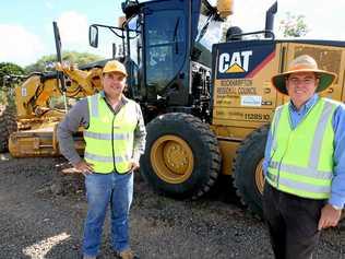 Peter Kluver of Hastings Deering delivers a new grader to Michael O'Keeffe from Rockhampton Regional Council. Picture: contributed