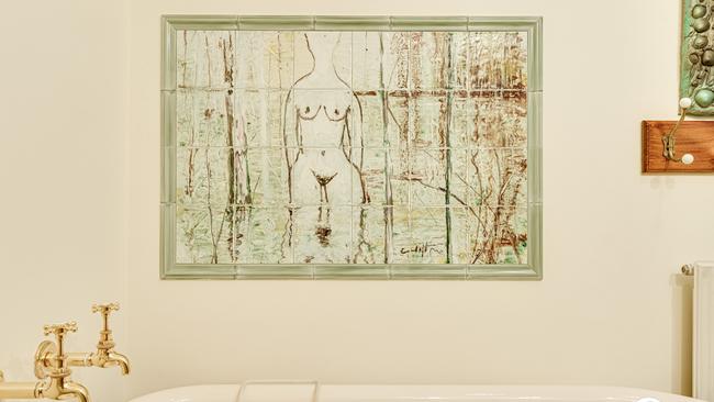 A bathroom fired-tile painting by Clifton Pughe is a rather unique inclusion.