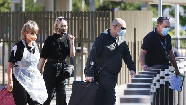 Travellers on the last flight from Sydney on Wednesday being transferred to hotel quarantine. Picture: Tara Croser