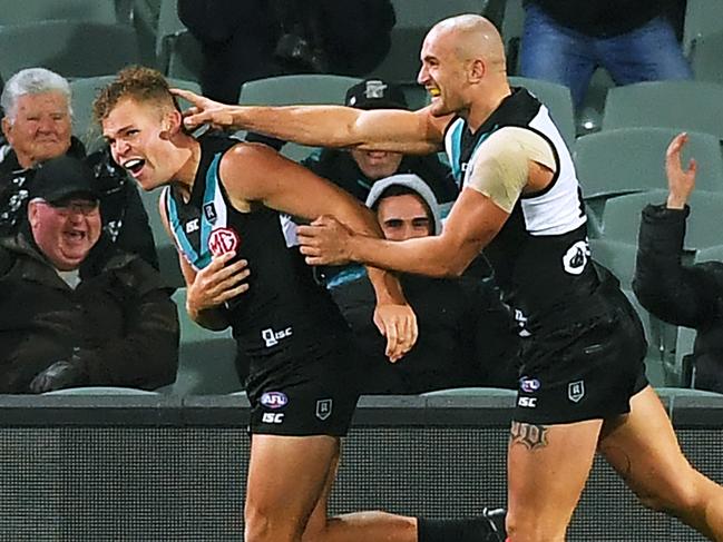 ADELAIDE, AUSTRALIA - AUGUST 08: Ollie Wines of Port Adelaide celebrates a goal with Sam Powell-Pepper of Port Adelaide during the round 11 AFL match between the Port Adelaide Power and the Richmond Tigers at Adelaide Oval on August 08, 2020 in Adelaide, Australia. (Photo by Mark Brake/Getty Images)