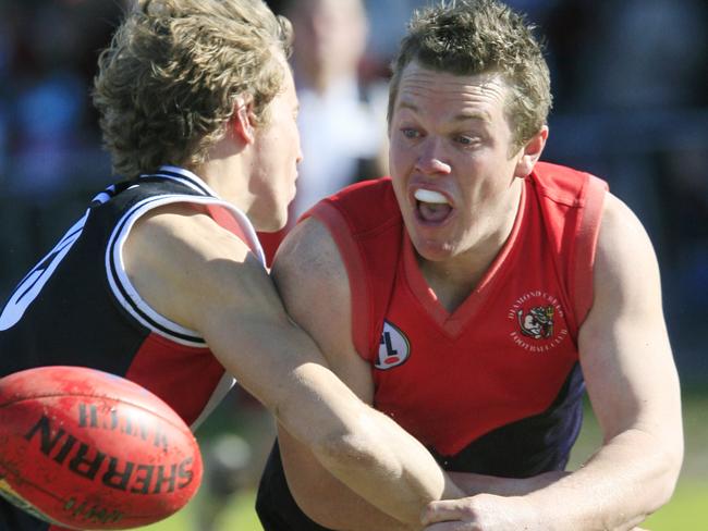 s08dv207 NFL Football  (Div 1): Watsonia v Diamond Creek at AK Lines Reserve, grimshaw st, Watsonia.. 7 Luke Jackson  for Diamond creek  handballs with 15 for Watsonia Jarrod Maggan tackling