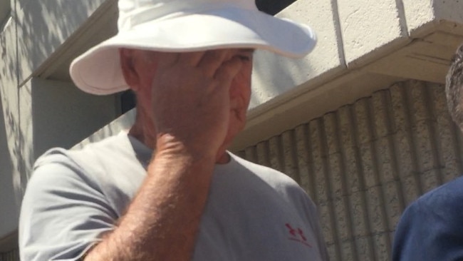 Wayne Clifford Howlett tried to disguise himself as he left court.