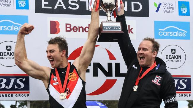 Tim Smith (left) and Luke Galliott (right) lift the cup. Picture: Davis Harrigan