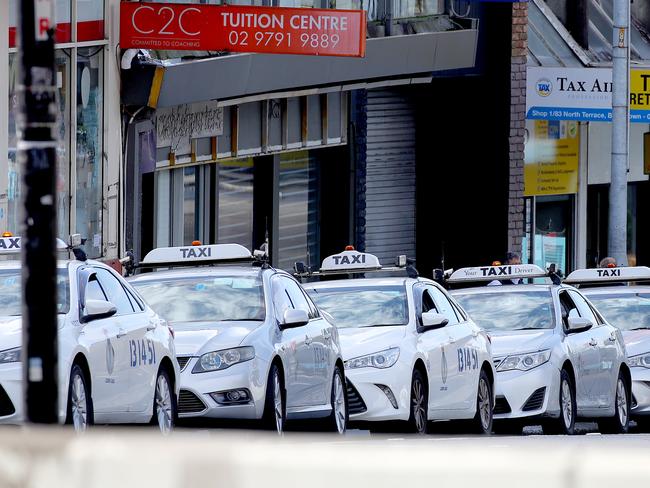 Areas around south west are a hot spot with the latest Delta strain of the coronavirus running rampant in areas like Bankstown and Auburn with streets empty and testing sites getting used. A long line of taxis on North Terrace in Bankstown. Picture: Toby Zerna