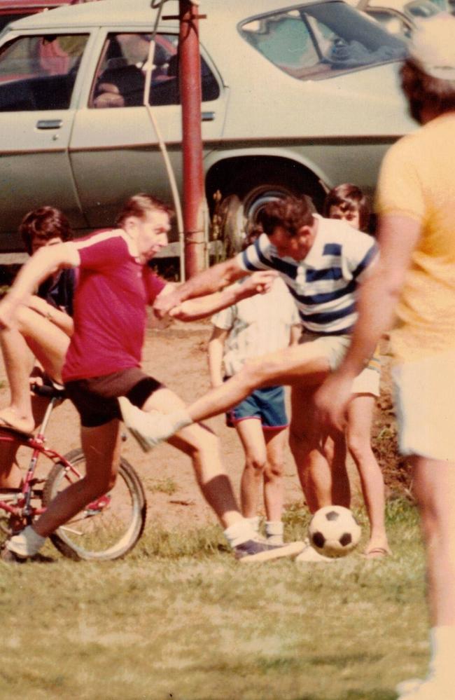 Barry Crimmins playing soccer with family.