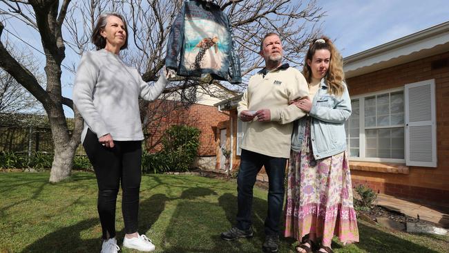 Chelsea Ireland's parents, Greg and Debrah Ireland, and her sister Maddie speak to media earlier in the week. The jacket is a Year 12 art project that Chelsea made. Picture: Tait Schmaal.