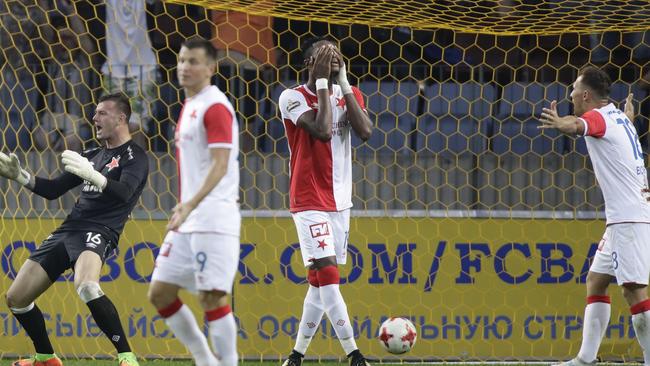 Slavia Prague's players react after BATE scored a second goal.