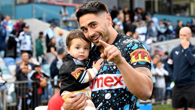 Shaun Johnson celebrates victory and his 200th NRL match with daughter Millah (Photo by Bradley Kanaris/Getty Images)