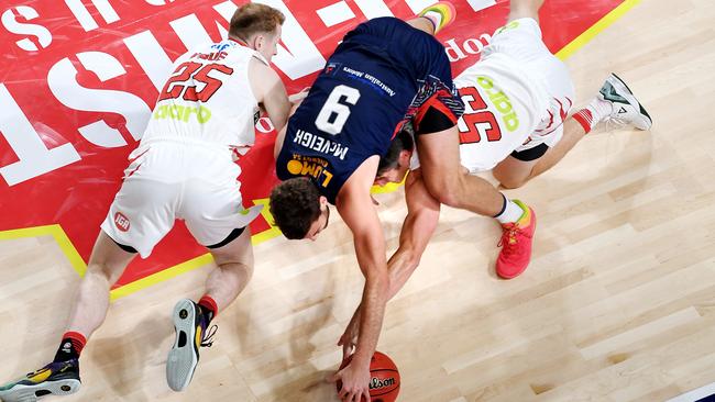 36er Jack McVeigh competes with Wildcats Rhys Vague and Damian Martin for a ground ball during the round seven NBL match at Titanium Security Arena on November 15. Picture: Mark Brake/Getty Images