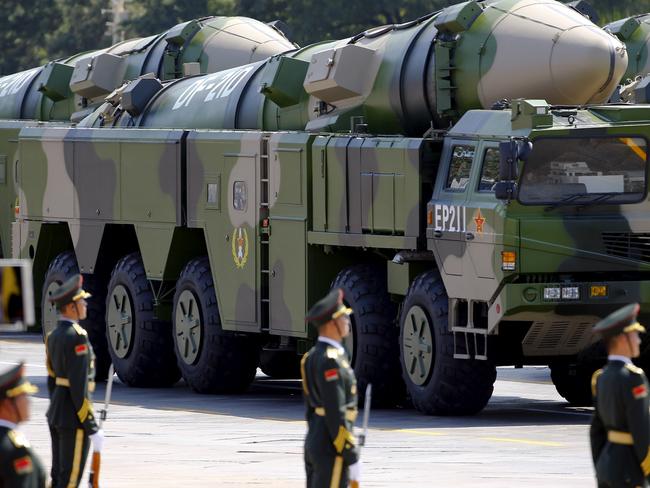 Military vehicles carrying DF-21D ballistic missiles roll to Tiananmen Square. A Pentagon report has raised the alarm over Beijing’s military ambitions. Picture: Reuters