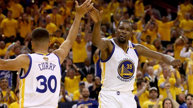 Stephen Curry #30 and Kevin Durant #35 of the Golden State Warriors.