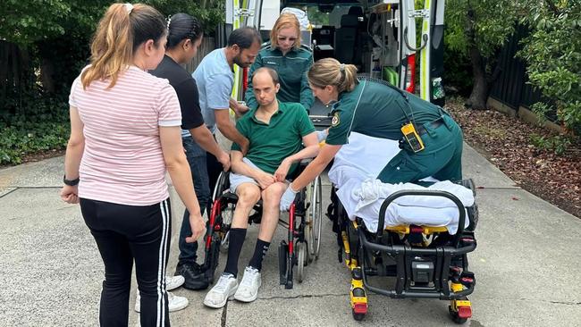 Ken Hird's son being taken away by ambulance to be cared for in hospital after he ran out of NDIS funds. Picture: Supplied