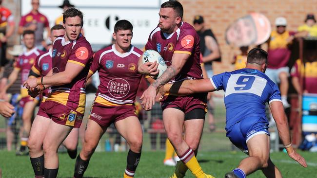 Matt Nicholson is wrapped up in a tackle. Picture: Steve Montgomery Sports Photography