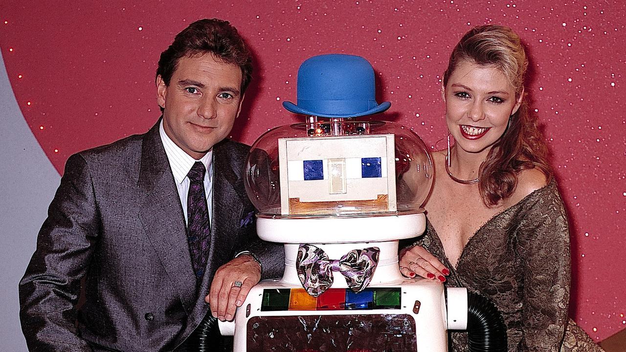 Greg Evans and Kerry Friend, who also hosted Perfect Match, with Dexter the Robot.