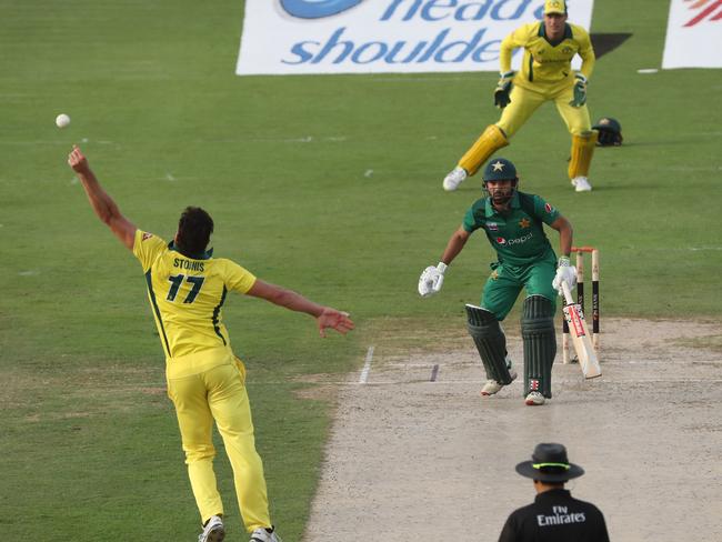 Marcus Stoinis (L) just misses a caught-and-bowled chance. Picture: Karim Sahib/AFP