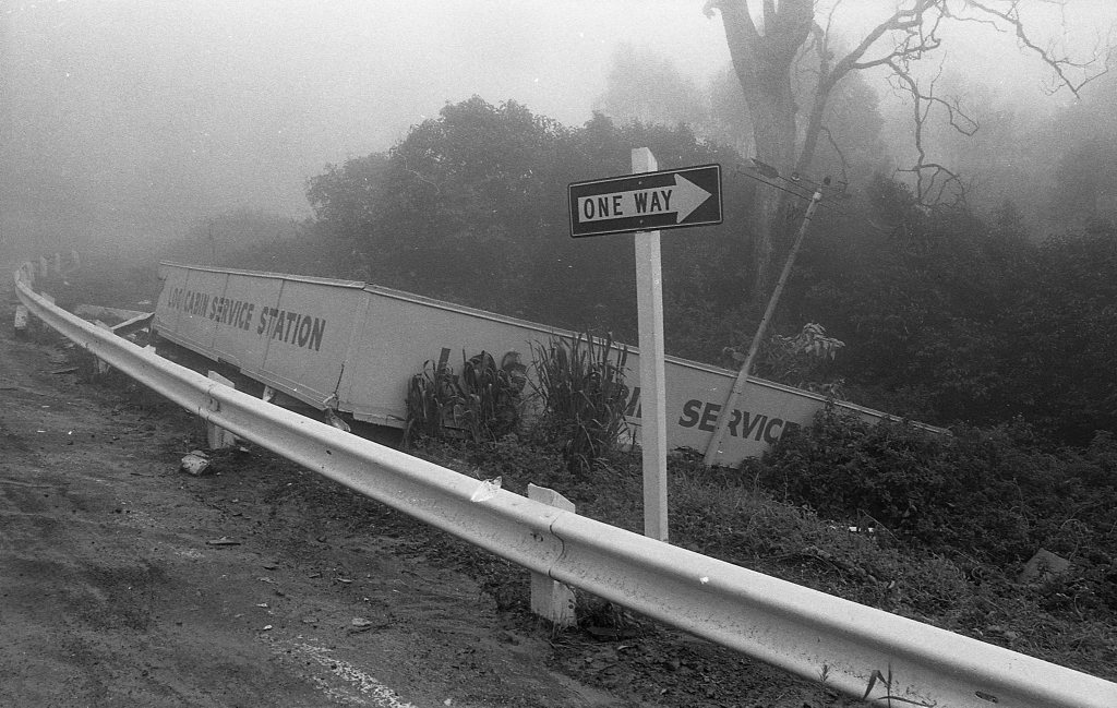 Historic: Toowoomba: Accidents: Clean up at the Log Cabin Service Station the morning after a semi-trailer rolled and crashed in the building removing most of the front of the station. The owner in 1978, Mr Neville Hammond started rebuilding immediately. Photo: Bruce Mackenzie / The Chronicle Neg: U875. Picture: Bruce Mackenzie