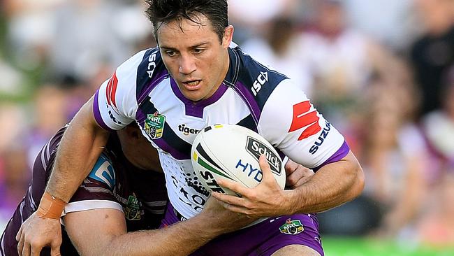 Cooper Cronk runs the ball against Manly.