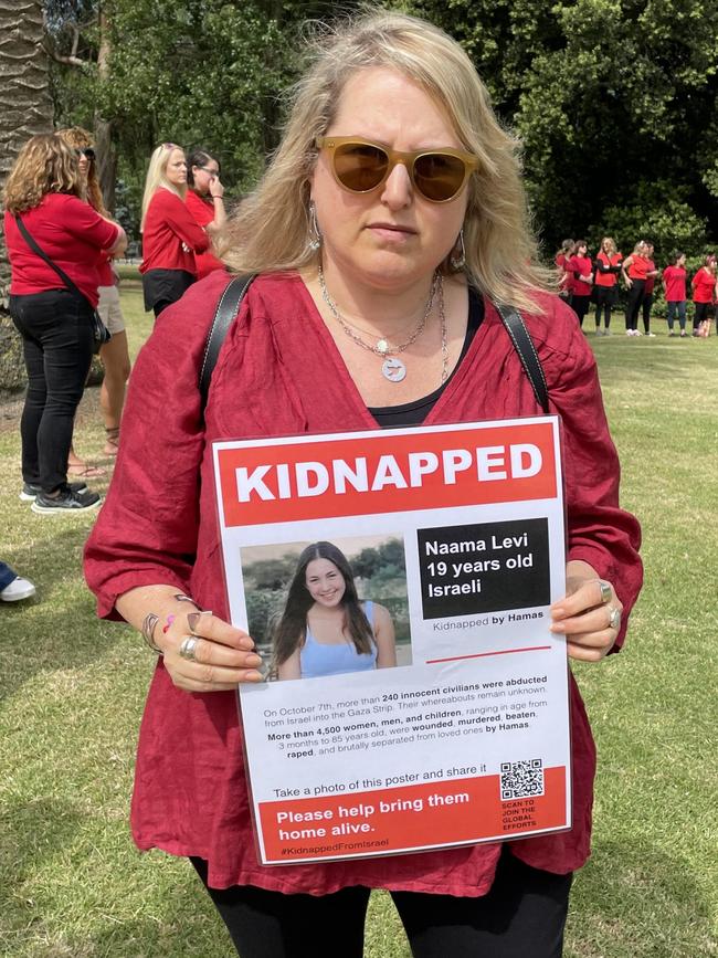 Nikki Perzuck holding a poster of her cousin.